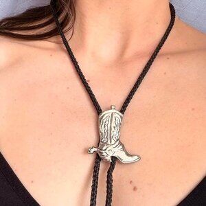 Silver tone cowboy boot bolo tie on black cord